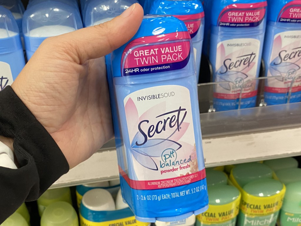 hand holding deodorant twin pack in store