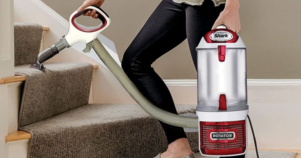 woman vacuuming stairs