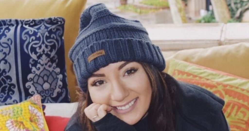 Young woman wearing a slouchy beanie