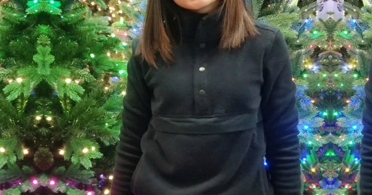 young woman wearing a black athletic fleece jacket