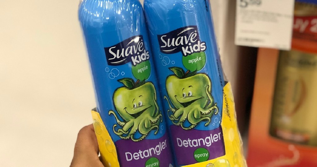 hand holding pack of two kids detangler sprays