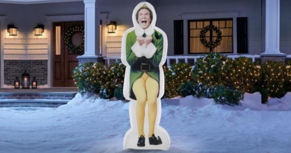 Large Buddy The Elf Christmas Yard Inflatable outside a home in the yard