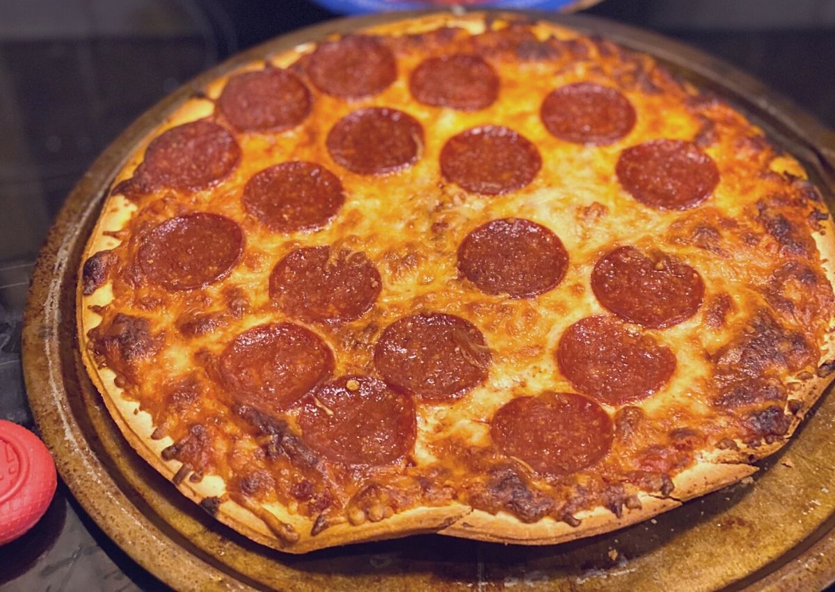 Tombstone pizza on a pizza pan