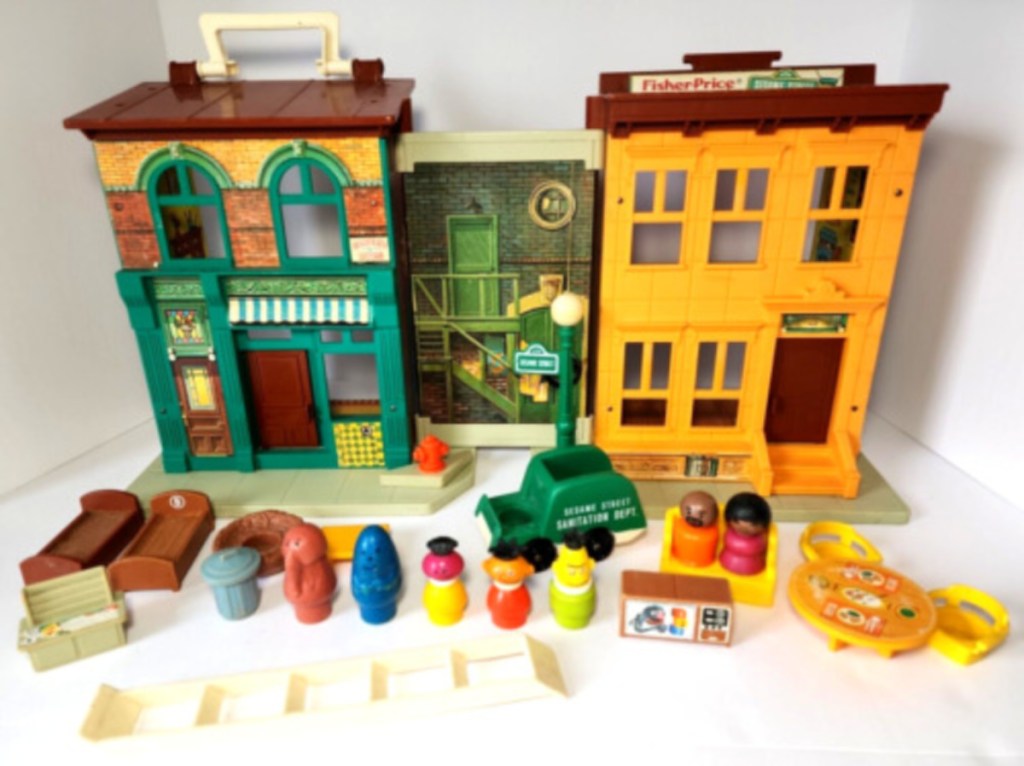 vintage fisher price family sesame street playset displayed on a table