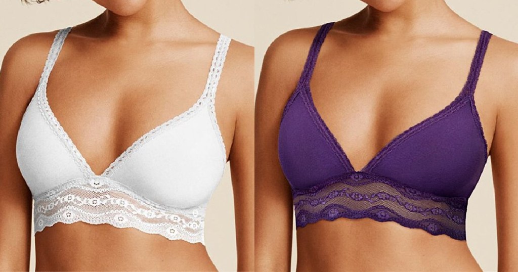 two women standing next to each other wearing a white bra and a purple bra