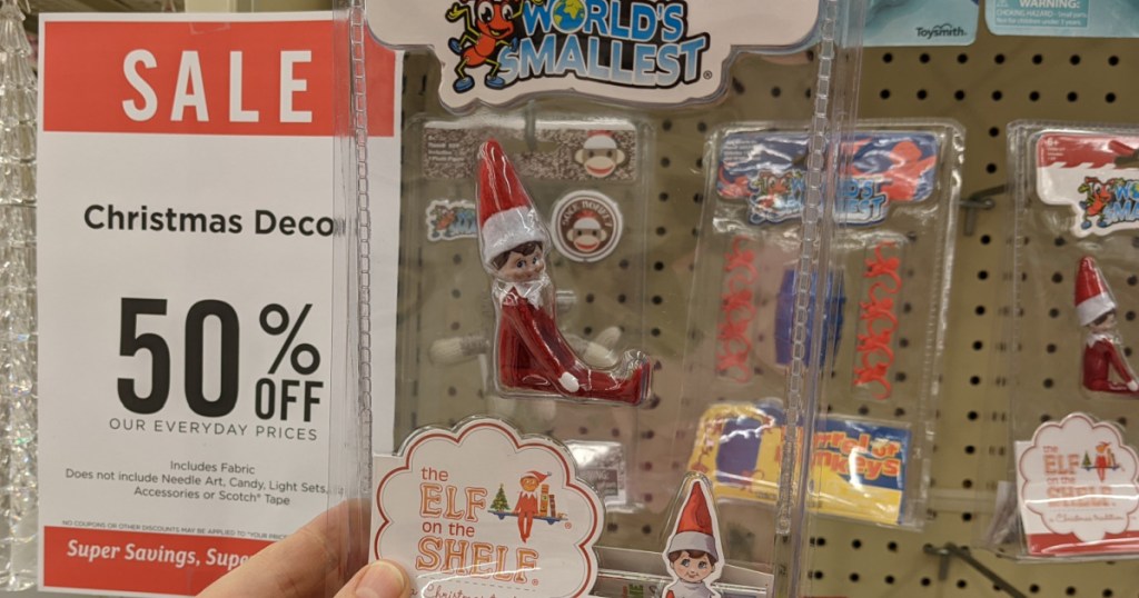 hand holdng the worlds smallest elf on the elf at hobby lobby 