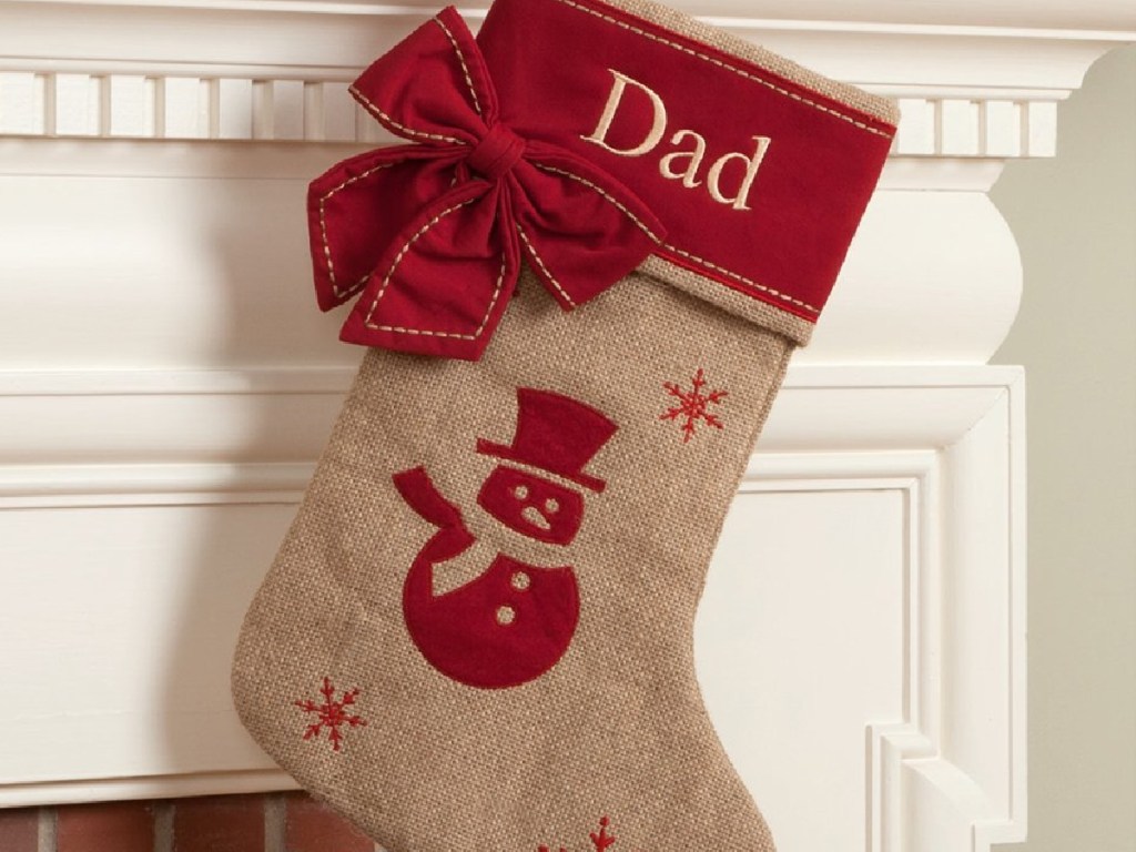 personalzed red burlap dad stocking hanging for a mantle