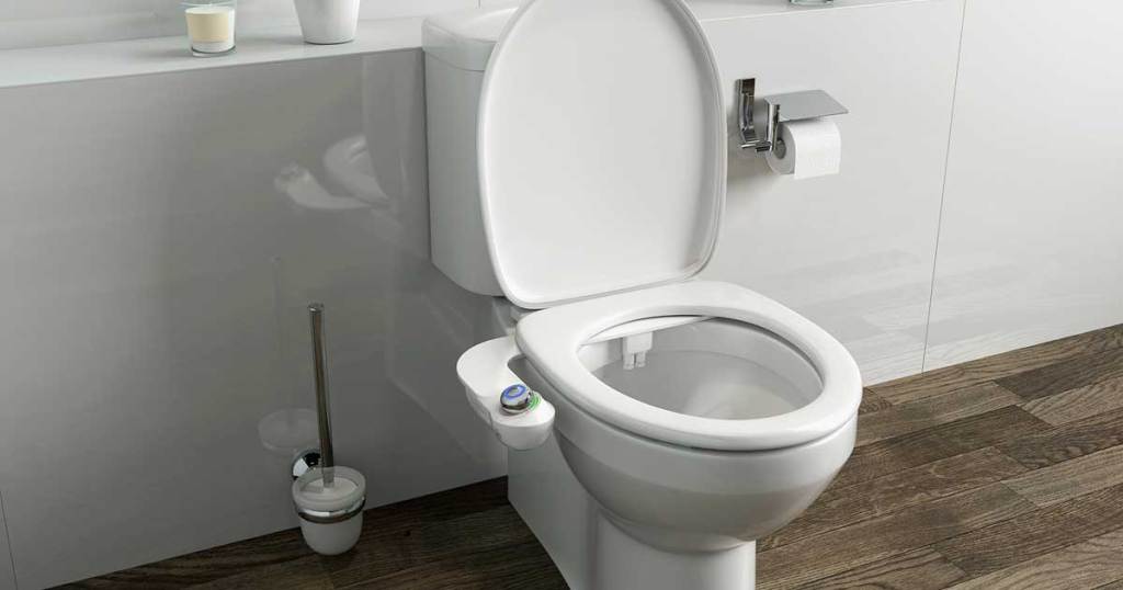 white toilet with a white bidet attachment