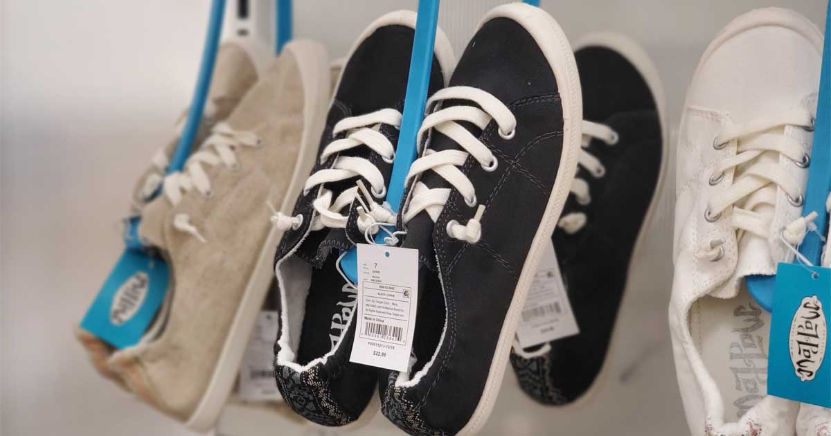 black shoes hanging on a display in store