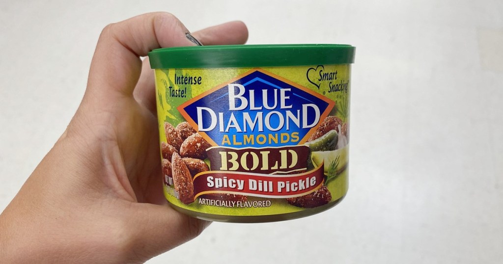 holding can of spicy dill pickle almonds