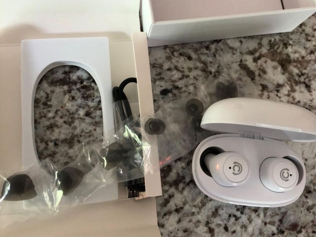 earbuds in white case with accessories