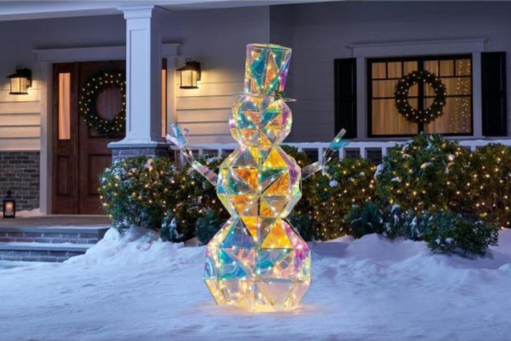 iridescent snowman lit up in yard