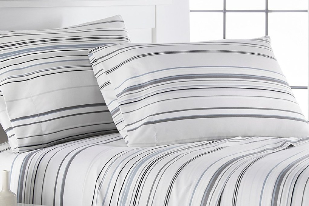 coastal stripes sheet set on bed with pillows