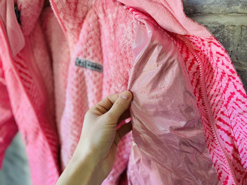 close up of pink jacket with omni heat on inside