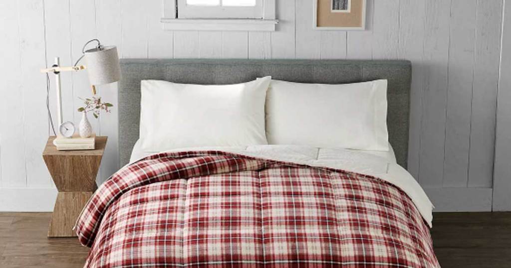 red plaid bed comforter on bed in room
