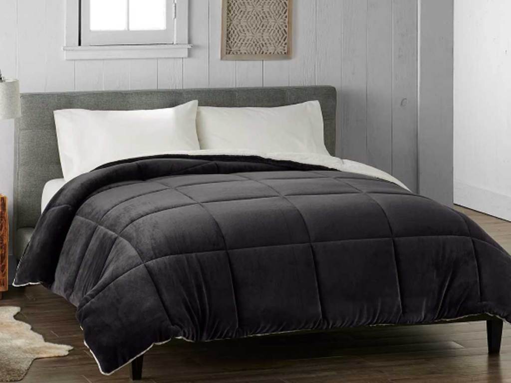 large gray cuddl duds comforter on bed
