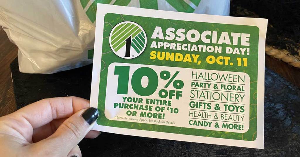 Hand holding a 10% off Dollar Tree coupon