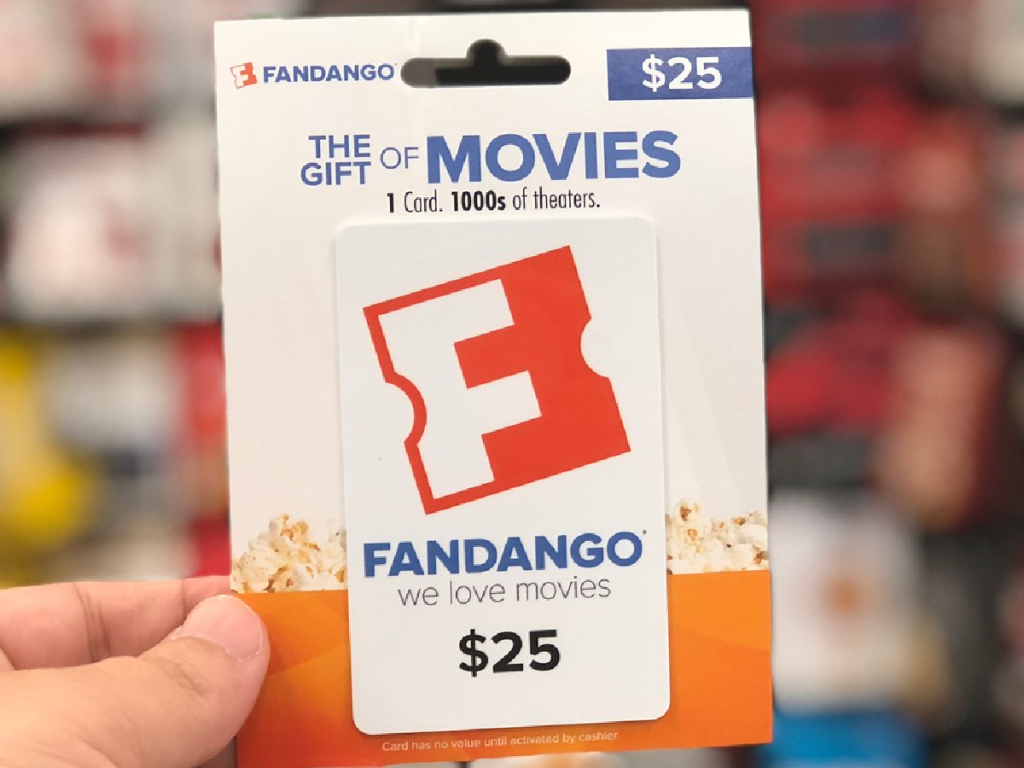 hand holding up gift card for Fandango