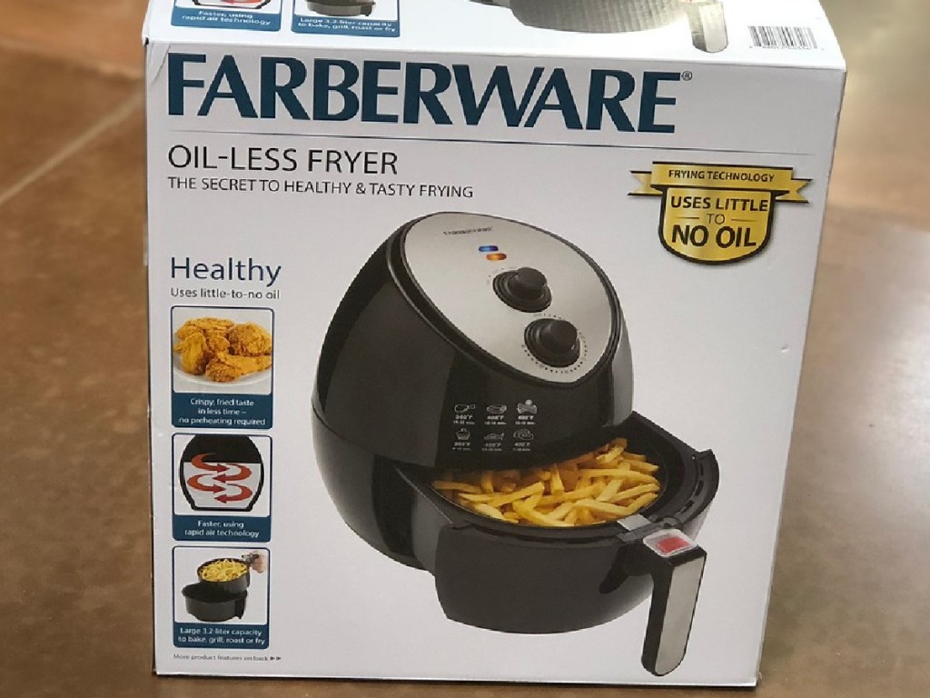 box with air fryer inside on floor