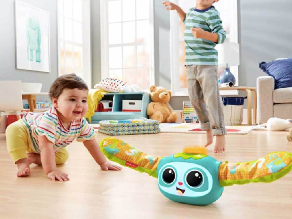 baby playing with rolling toy
