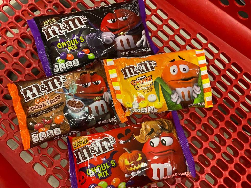 bags of halloween candy in a shopping cart