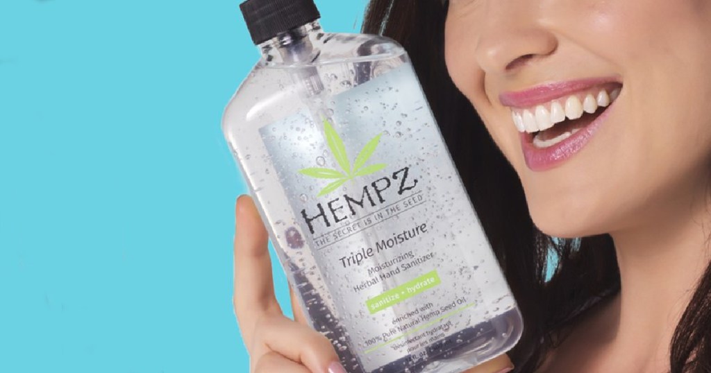 hempz hand sanitizer near womans face