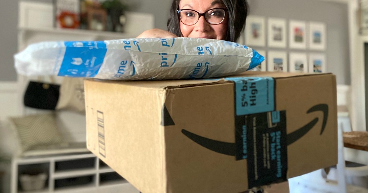 Woman holding packages with Amazon logo that came with free shipping