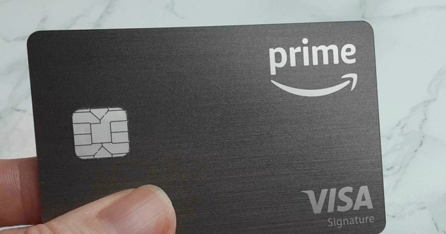 hand holding an amazon prime visa credit card