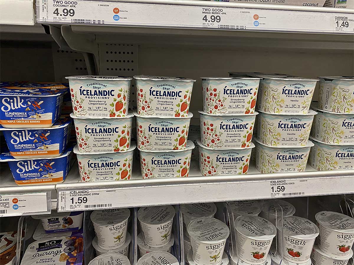 cups of yogurt on display in a store