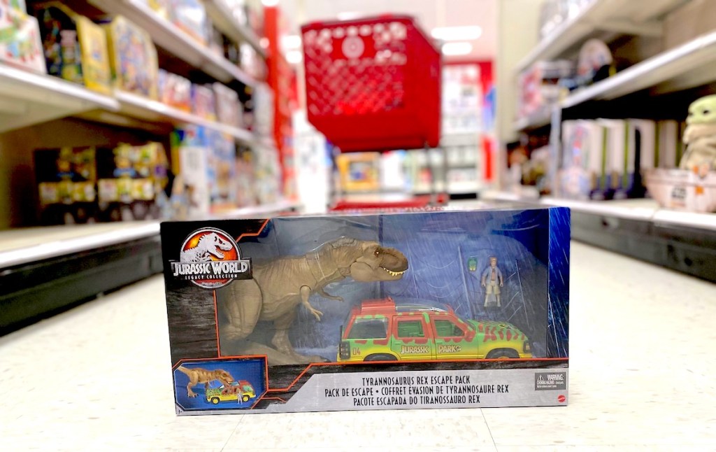 jurassic world toy on floor in store with target red cart in background