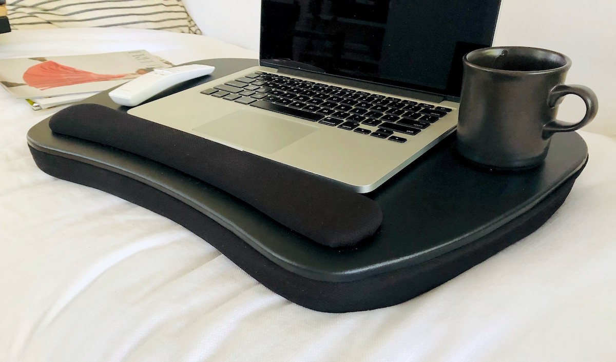 laptop sitting next to coffee mug