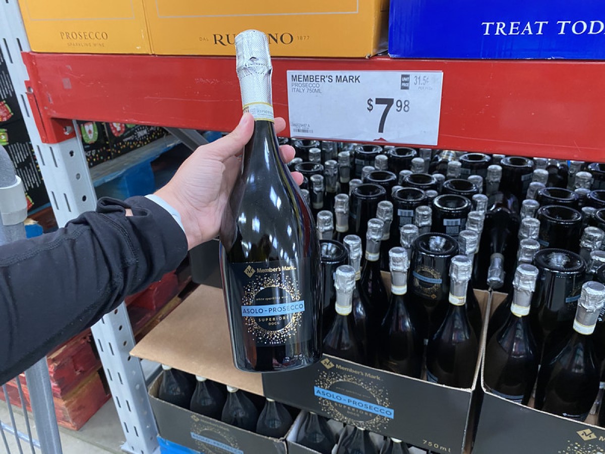 holding bottle of Riesling at Sam's Club