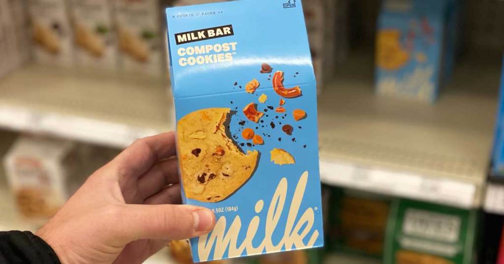 hand holding a box of cookies in store