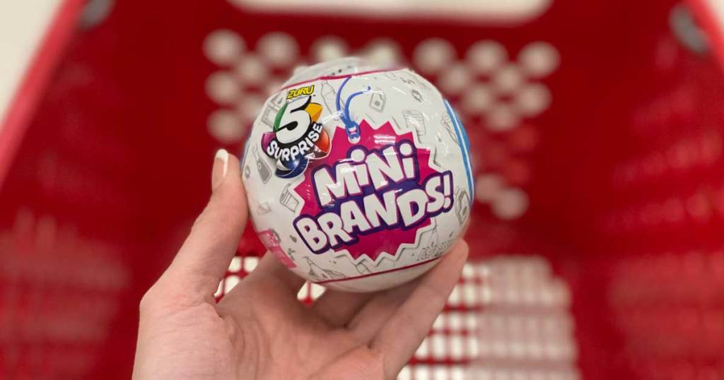 hand holding mini brand surprise balls