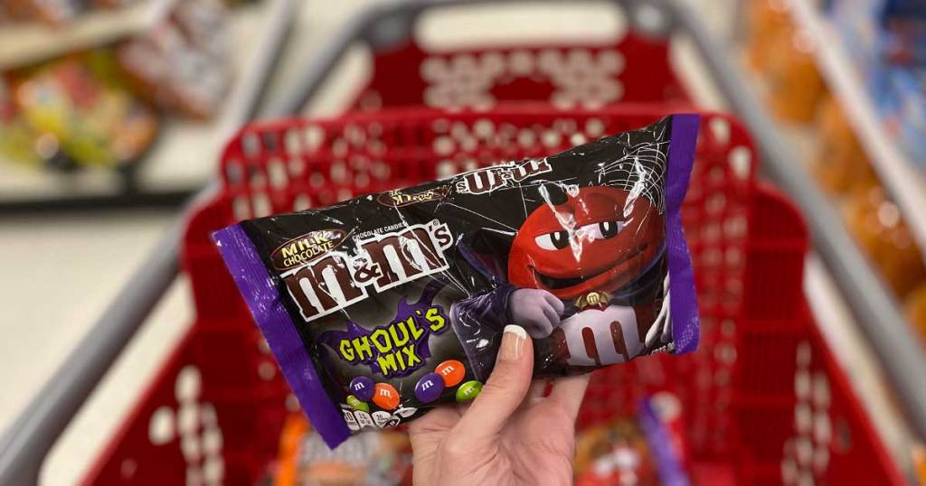 hand holding up a bag of M&M's TARGET