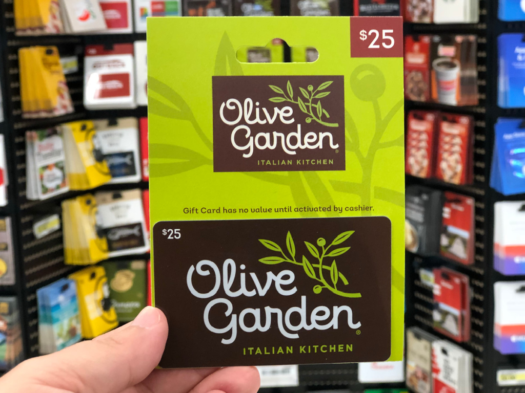 hand holding up gift card to Olive Garden