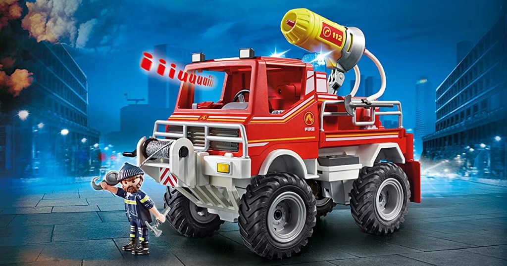 playmobile fire truck in action blue background