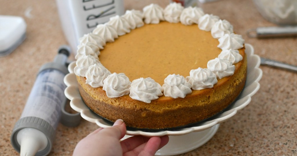 pumpkin cheesecake on a cake plate