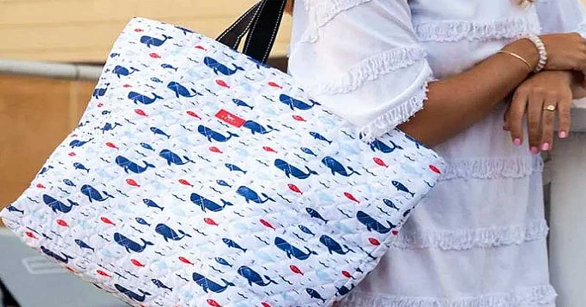 whale tote worn by woman