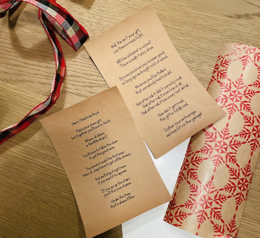 two letters on brown paper laying on wooden table