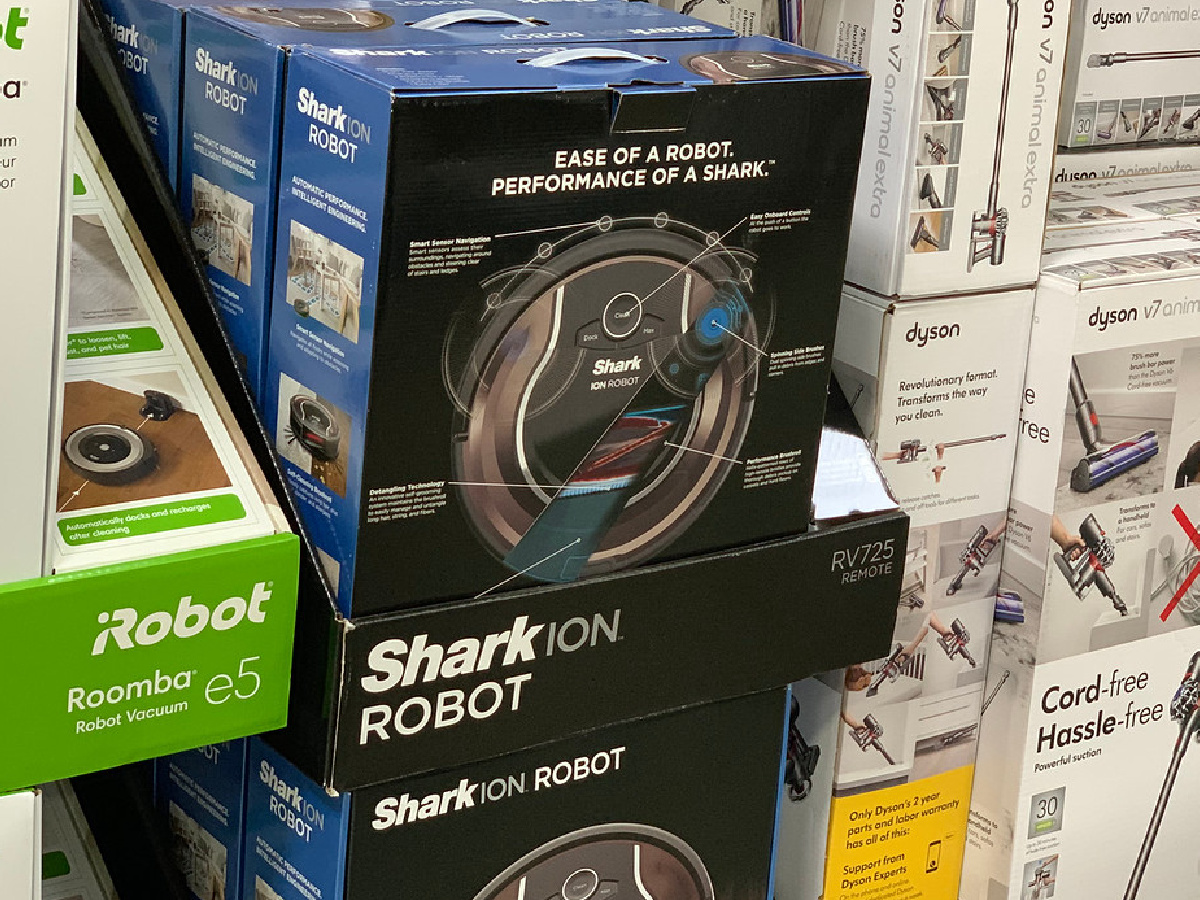 store shelf with vacuum robots on sale