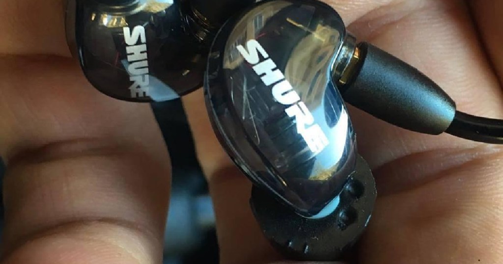 shure earbuds in palm of hand