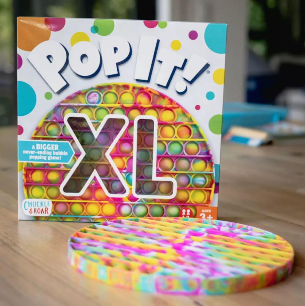 pop it xl box with round toy on table