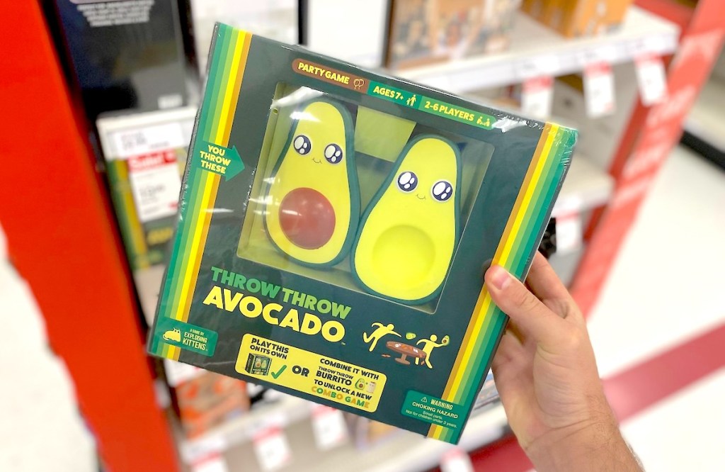 hand holding throw throw avocado game in hand