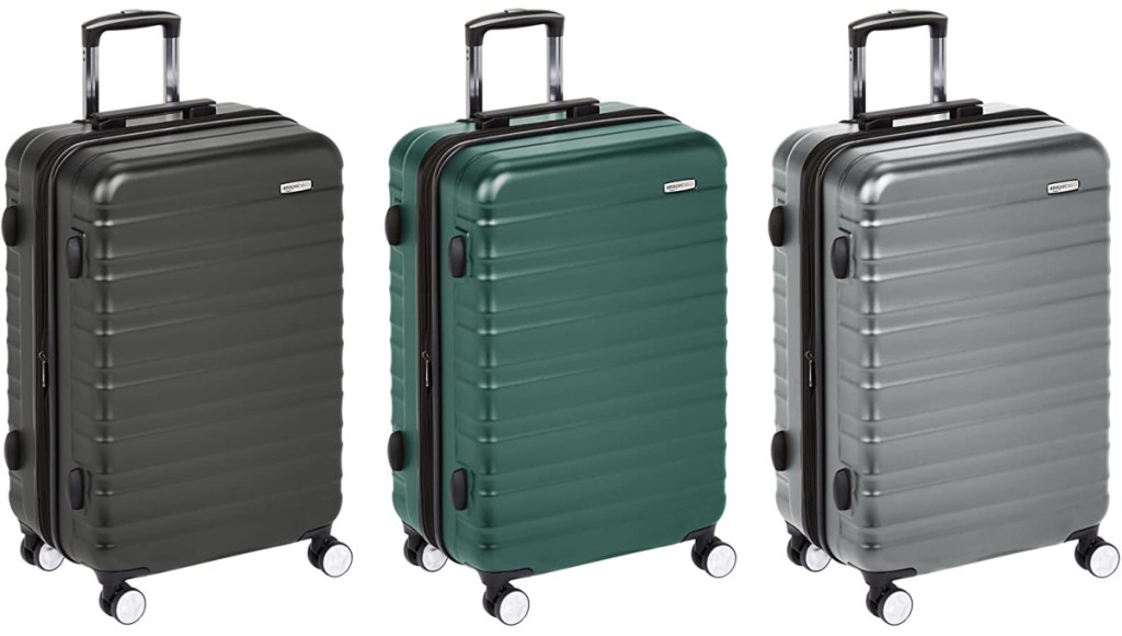 three amazonbasics luggage in green gray and black