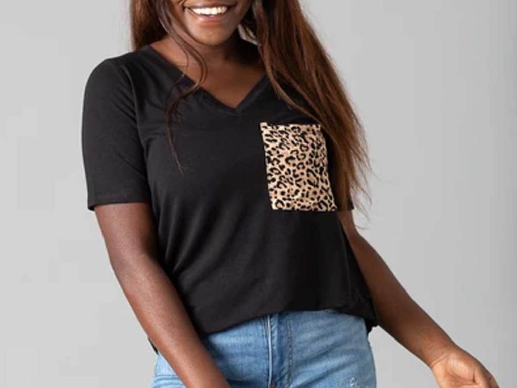 model wearing a black t shirt with a leopard print pocket