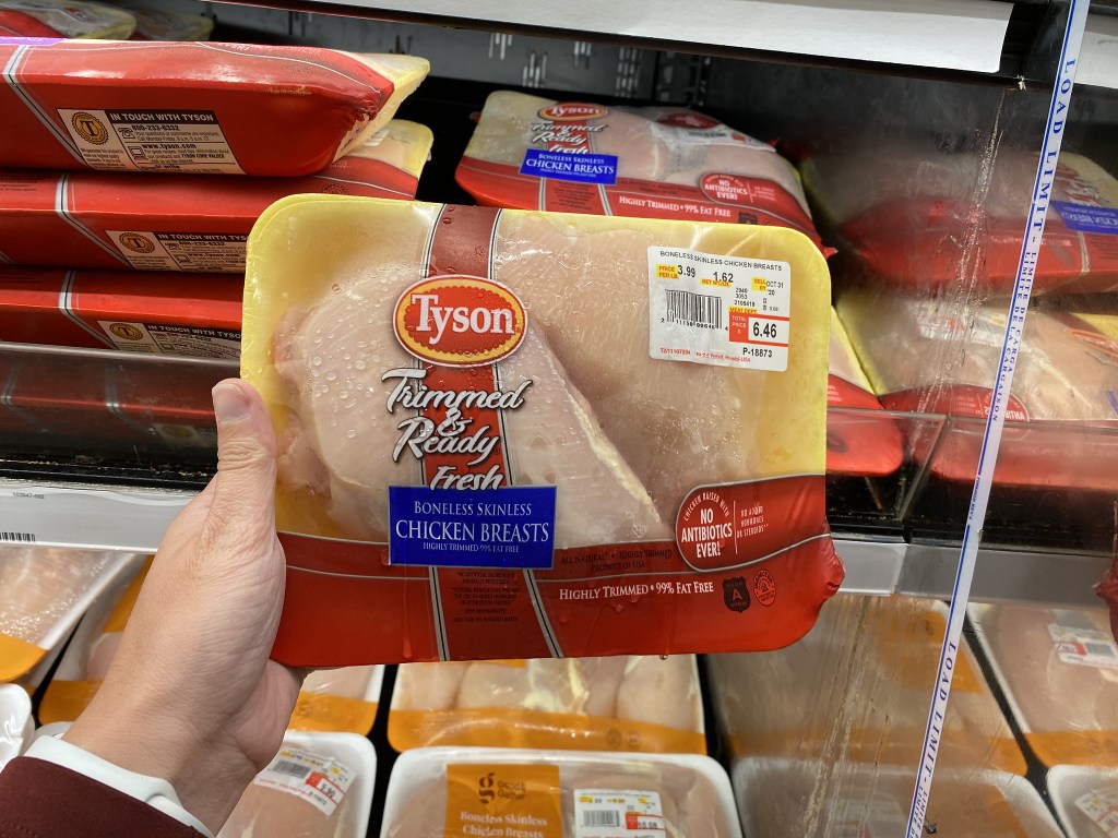 tyson chicken breasts in hand in store