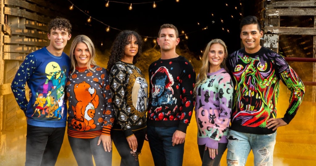 6 adults wearing ugly Halloween sweaters