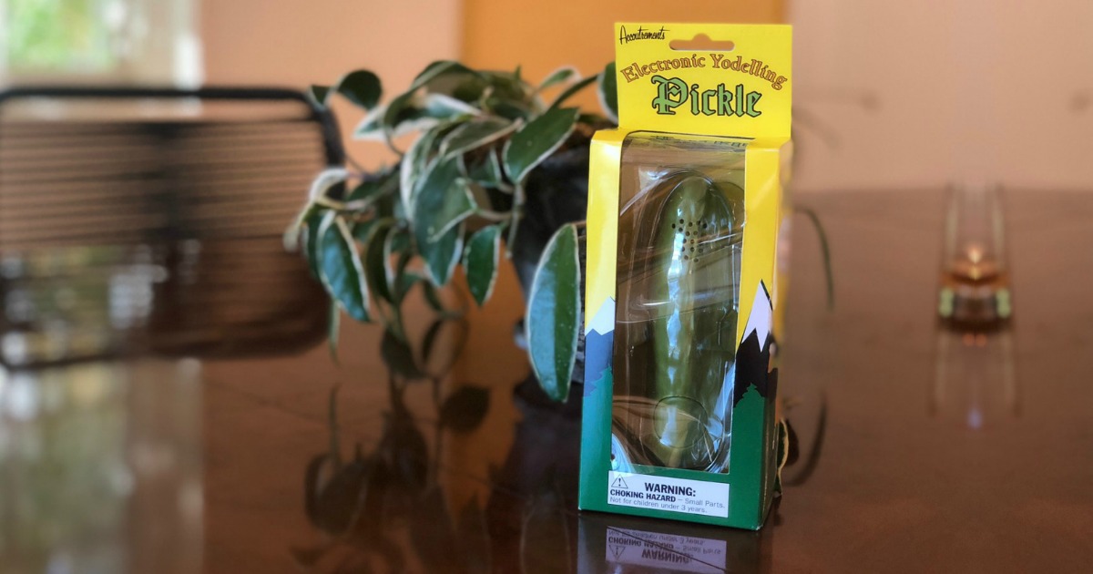 yodeling pickle in packaging next to an ivy plant
