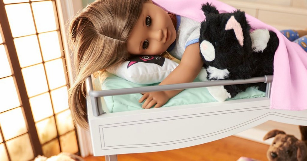 American Girl dolls on a doll-size bunk bed